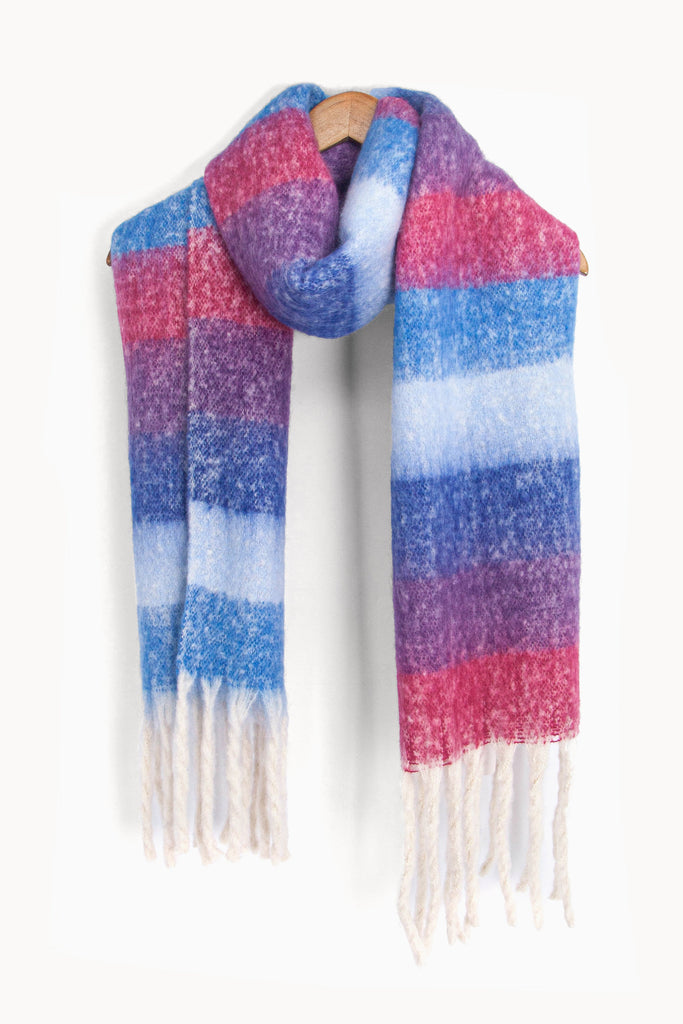 showing the pink, purple and blue colour block winter scarf draped around a coat hanger, showing how it would look when worn.