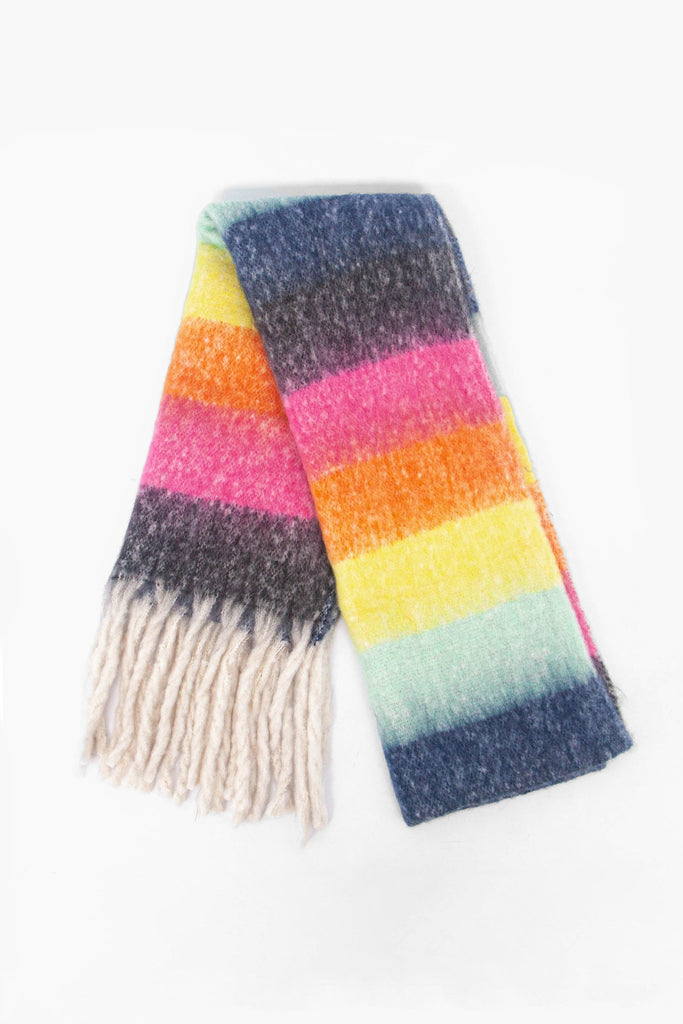 showing the scarf folded while laying flat, the colour block stripe pattern is highlighted. there are blue, yellow, orange, pink and black tones visible in the design.