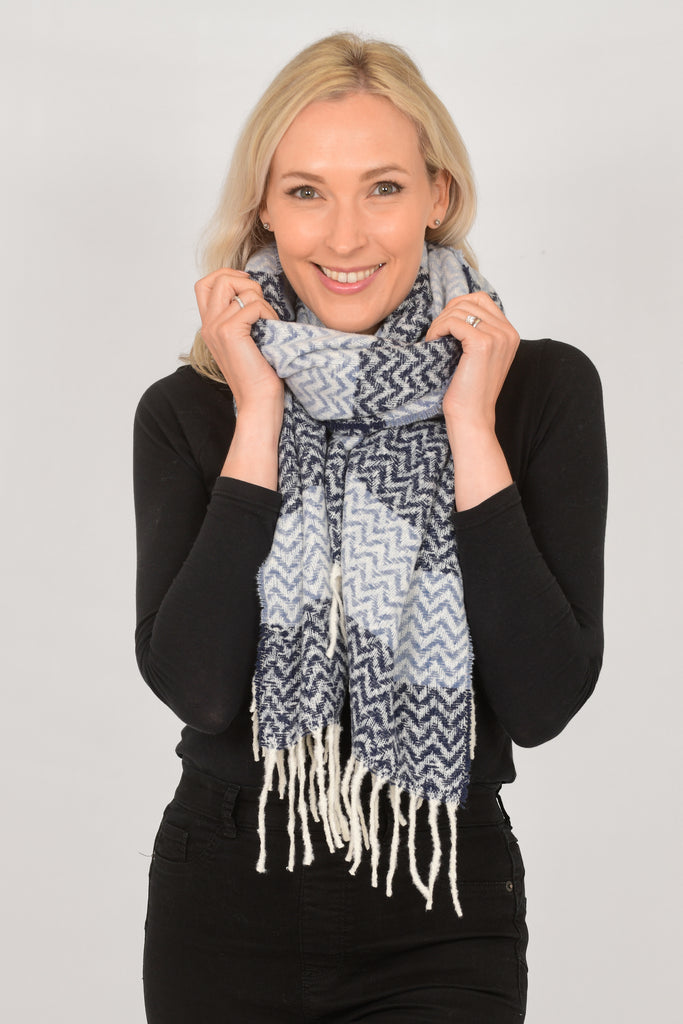 model wearing a blue chevron pattern winter scarf