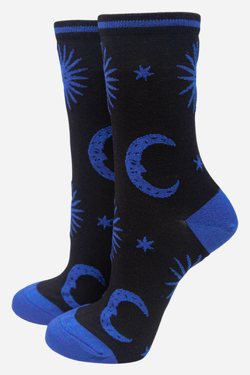 black socks with blue, stars, crescent moons and suns with blue sparkly glitter accents 