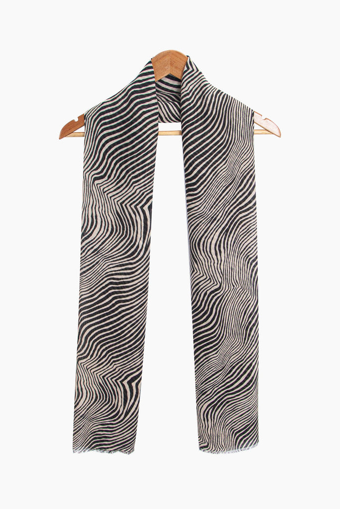 phoenix-lightweight-scarf-cream-zebra-print-draped-around-coat-hanger