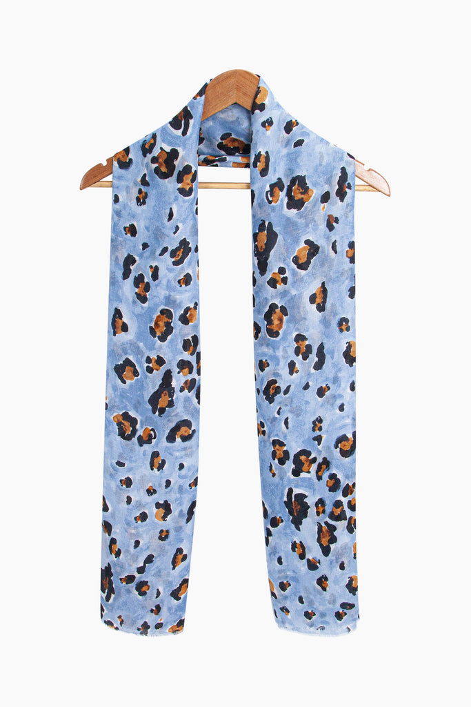 raya-lightweight-scarf-blue-leopard-print-draped-around-coat-hanger