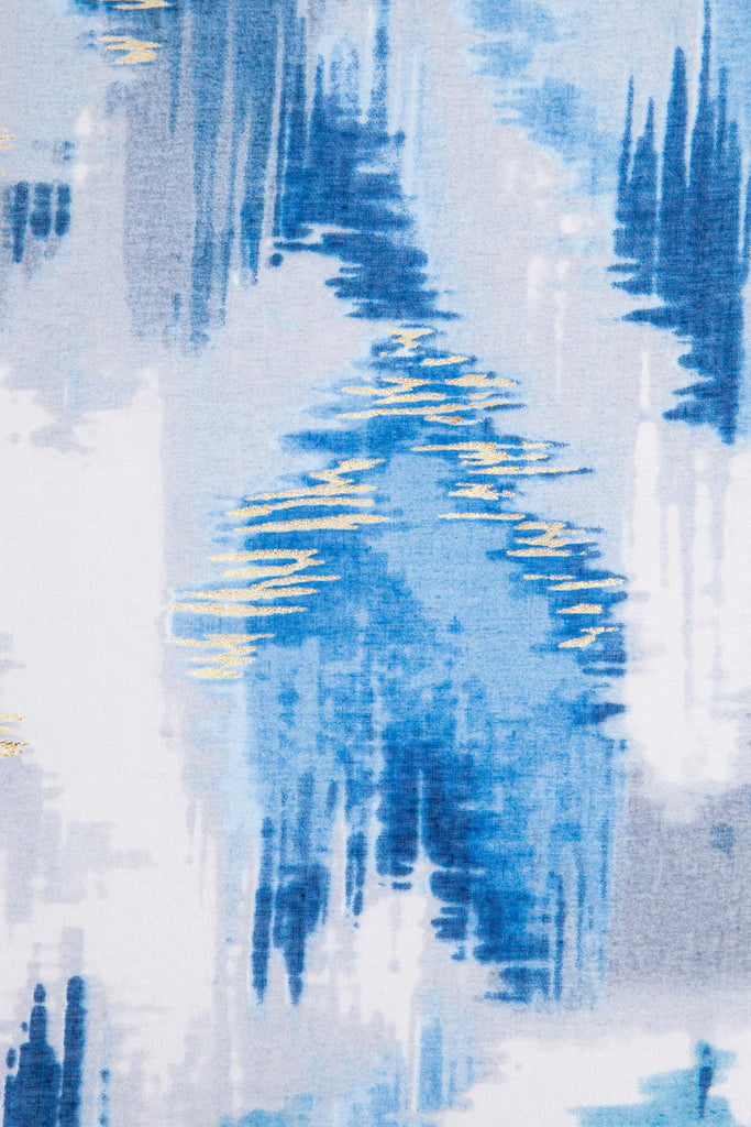 rumi-lightweight-scarf-blue-glitter-ikat-print-close-up-pattern