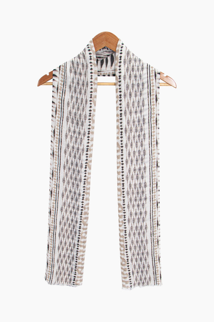 madeline-lightweight-scarf-neutral-boho-geometric-draped-around-a-coat-hanger