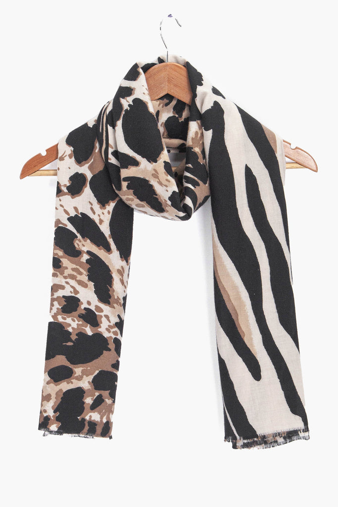 mabel-cream-animal-print-lightweight-scarf-draped-on-coat-hanger