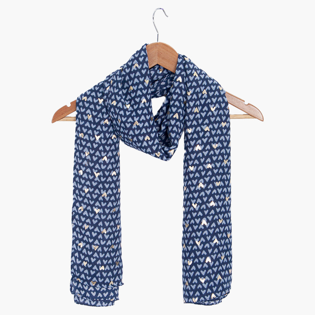 rainie-blue-metallic-hearts-lightweight-scarf-draped-on-coat-hanger