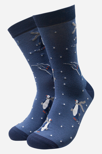 blue bamboo socks with a pattern of ice skating penguins