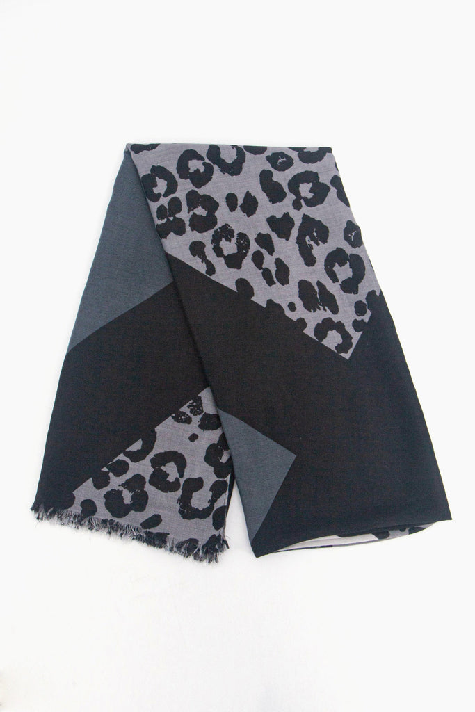 showing the scarf folded, the grey and black colour block and leopard print pattern is shown to cover the full design