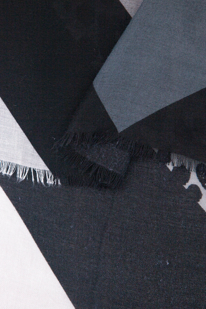 close up of the soft viscose fabric, the grey and black colourways are clearly visible