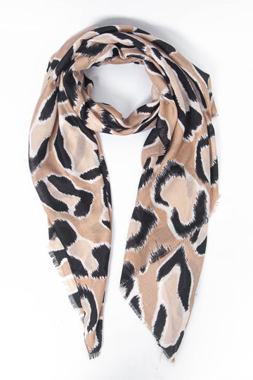 neutral beige lightweight scarf with a large bold black leopard print pattern