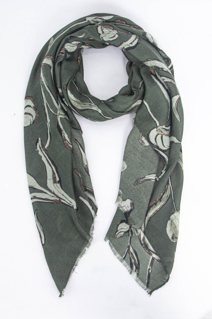 khaki scarf with a large floral pattern in light green with gold glitter accents throughout