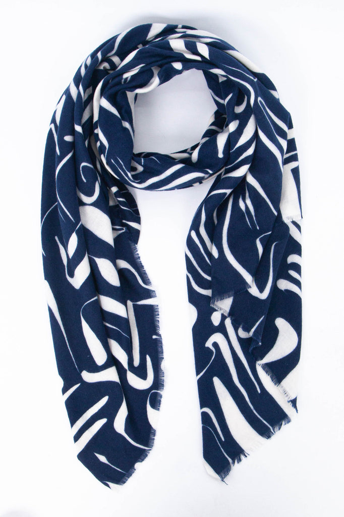 navy blue scarf with a contrasting white abstract print pattern all over