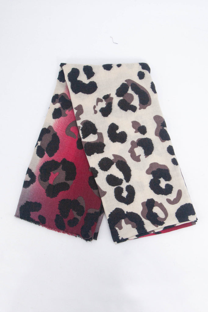 showing the scarf folded, the fuchsia pink and cream leopard print pattern is shown to cover the whole of the scarf