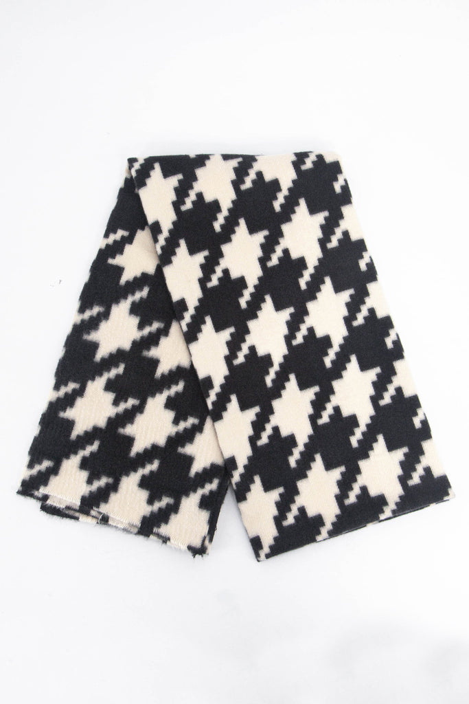 showing the scarf folded, the black and cream houndstooth pattern is shown to cover the whole design