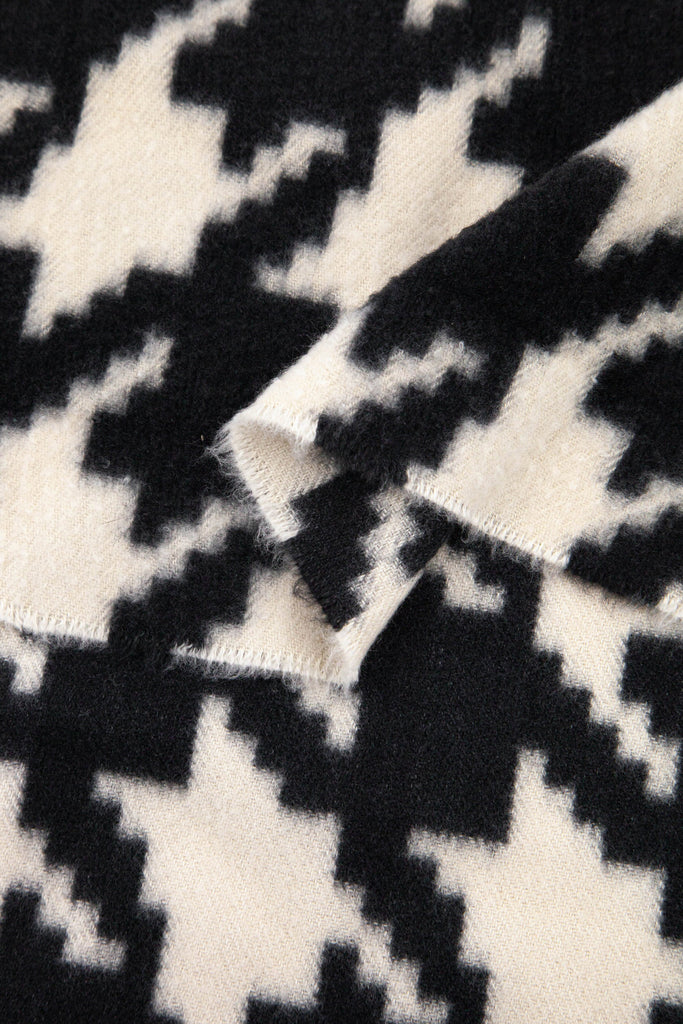 close up of the soft viscose fabric, the black and cream colourways are clearly visible