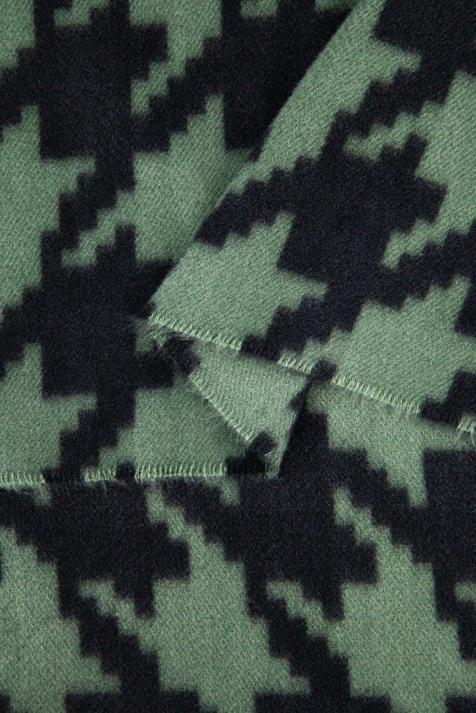 showing the scarf folded, the khaki green and black houndstooth pattern is shown to cover the whole design
