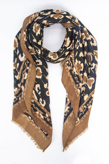 black and neutral tone leopard print scarf with a plain neutral border and subtle gold metallic stripe throughout 