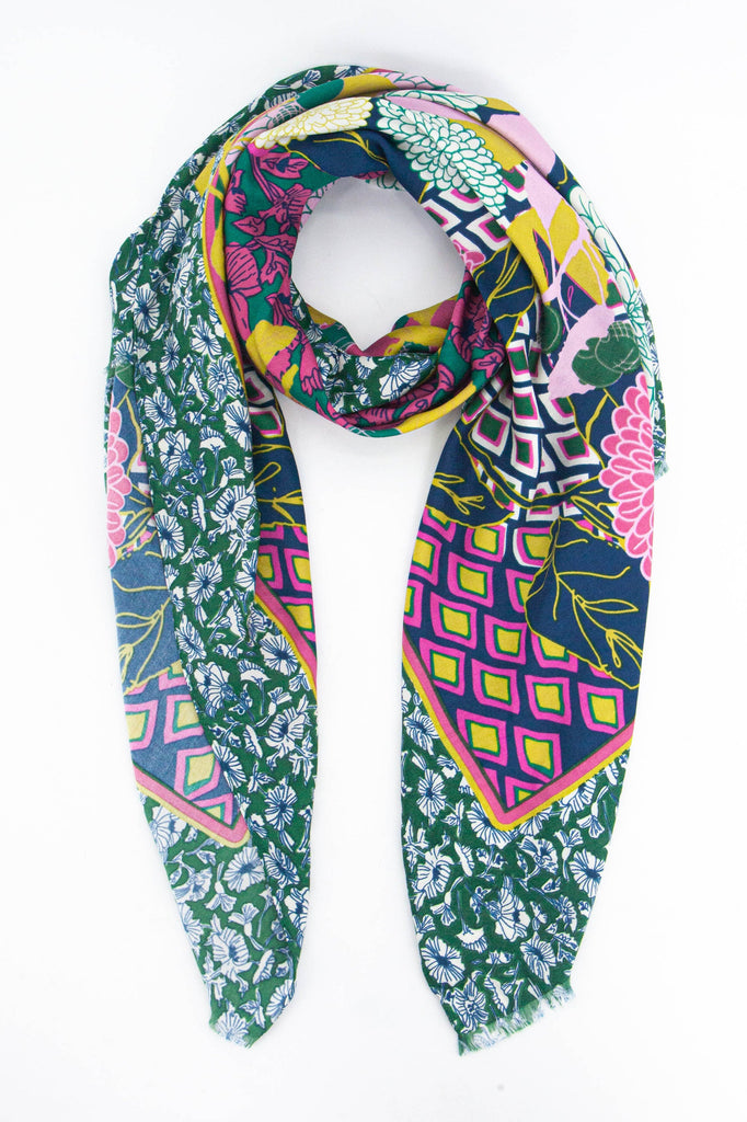 green, pink and yellow scarf with contrasting floral and geometric patterns 