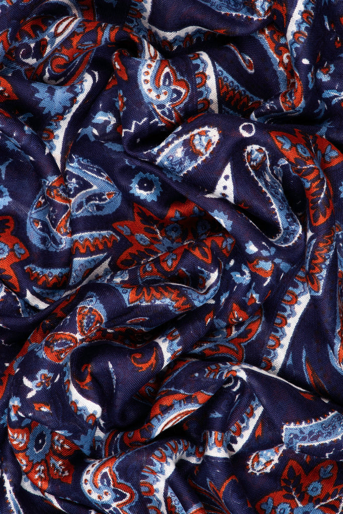 close up of the soft viscose fabric, the navy blue and coral colourways are clearly visible
