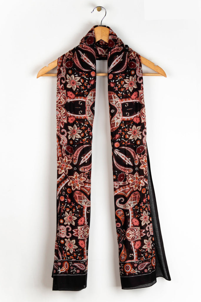 close up of the soft viscose fabric, the black and coral colourways are clearly visible