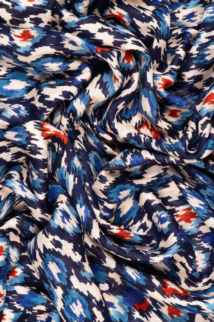 close up of the soft viscose fabric, the beige, blue and orange colourways are clearly visible
