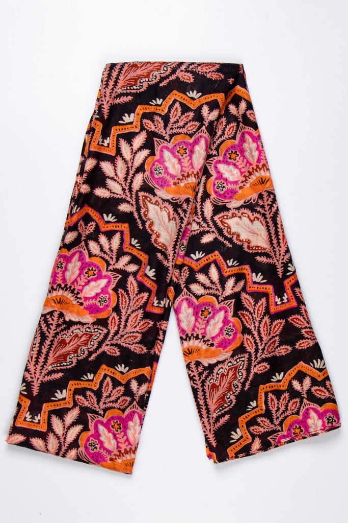 showing the scarf folded, the black, orange and pink floral mosaic pattern is clearly shown and covers the entire scarf.