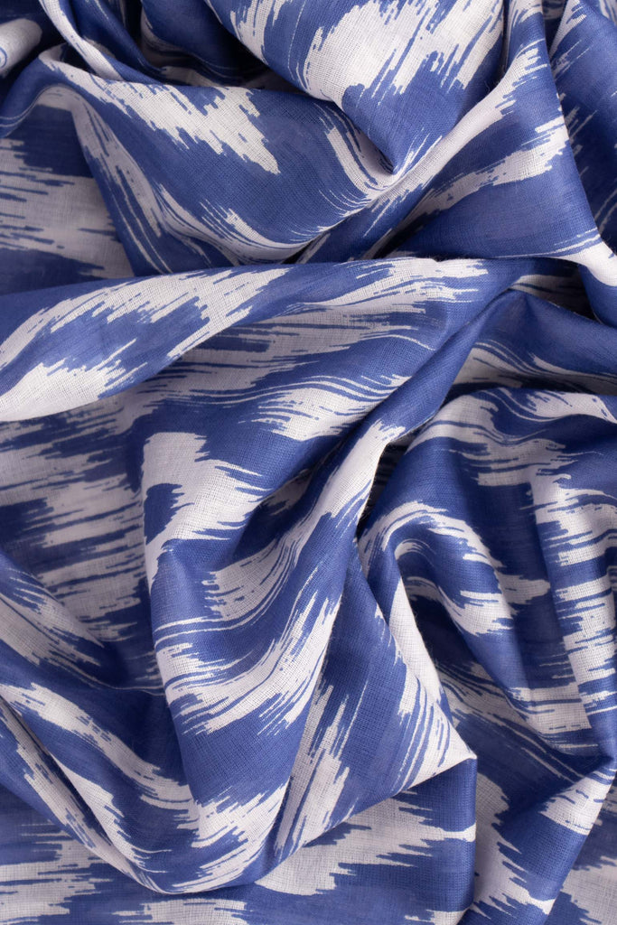 close up image of the lightweight cotton fabric and deep blue aztec pattern
