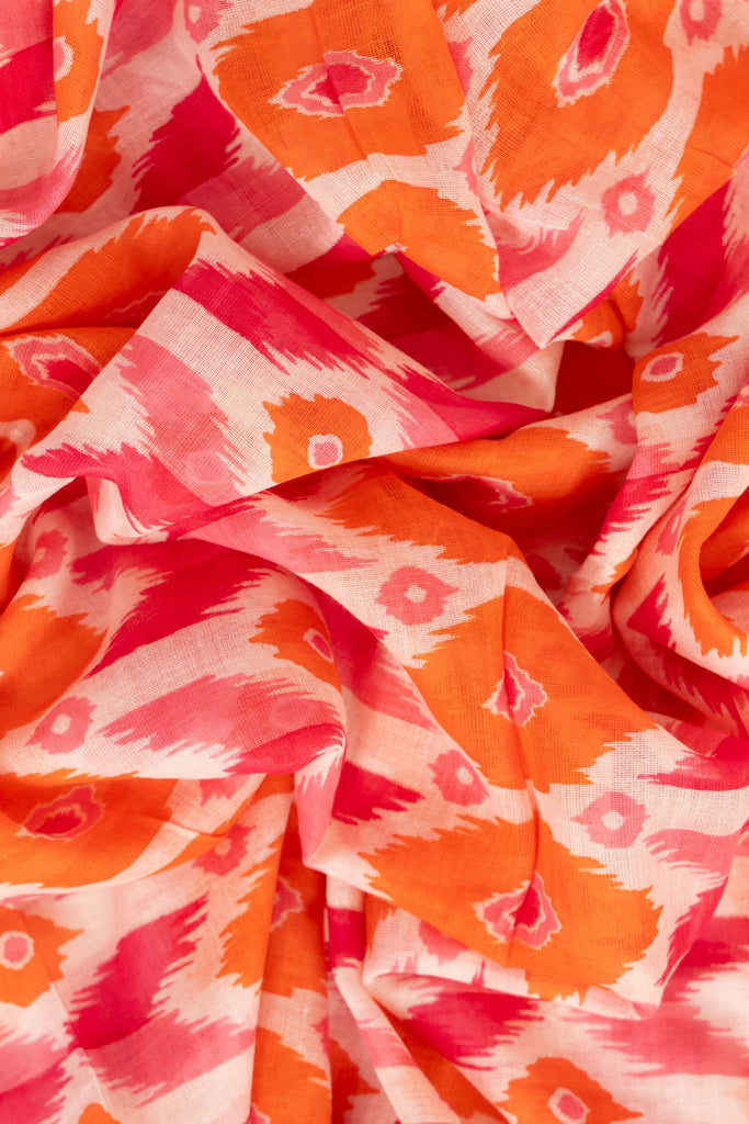 ayla-lightweight-scarf-pink-orange-ikat-print-close-up-soft-material
