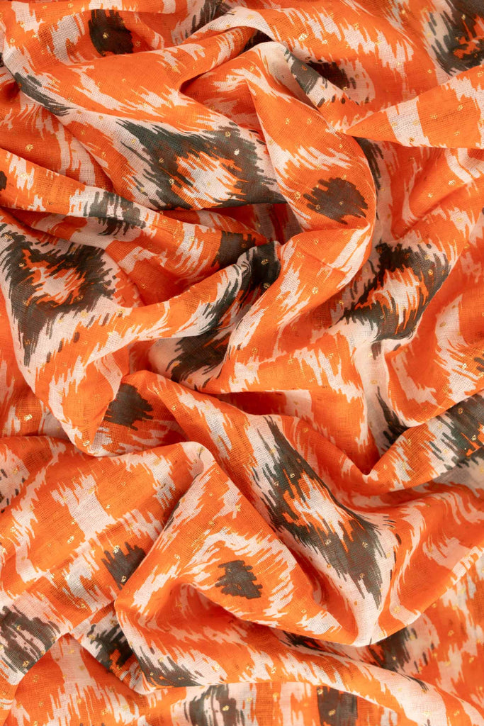 rani-lightweight-scarf-orange-khaki-aztec-print-close-up-soft-fabric
