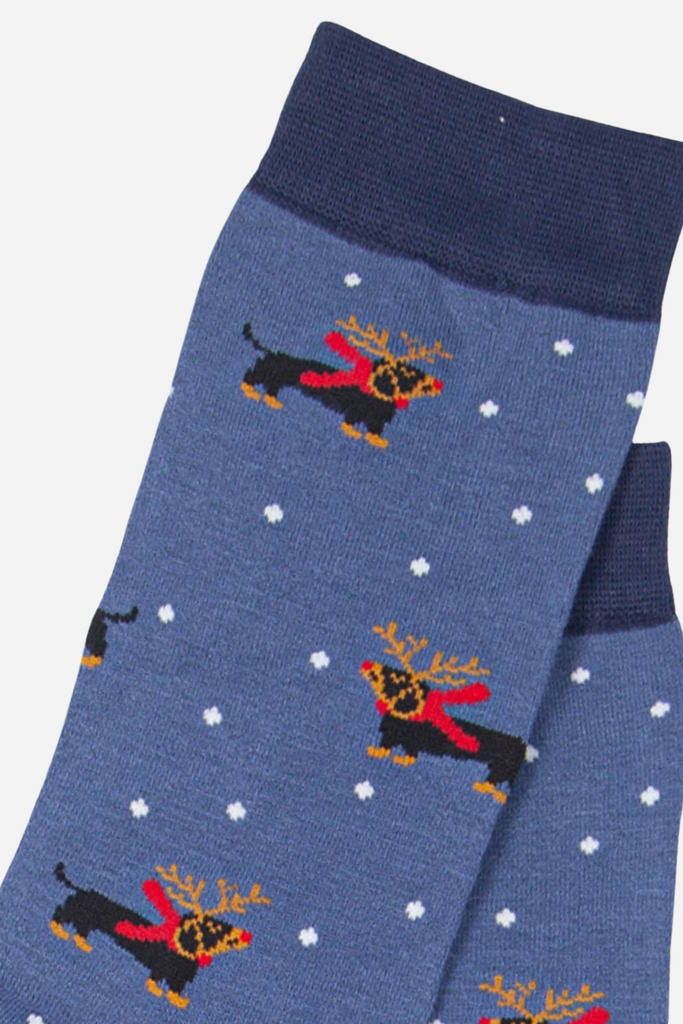 close up of the sausage dog wearing festive reindeer antlers