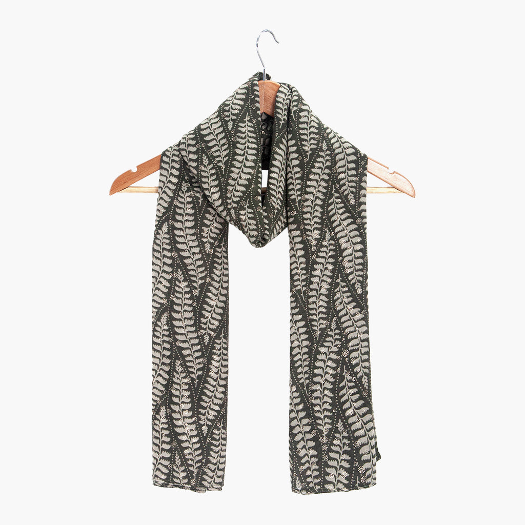 clover-khaki-fern-leaf-lightweight-scarf-draped-on-coat-hanger