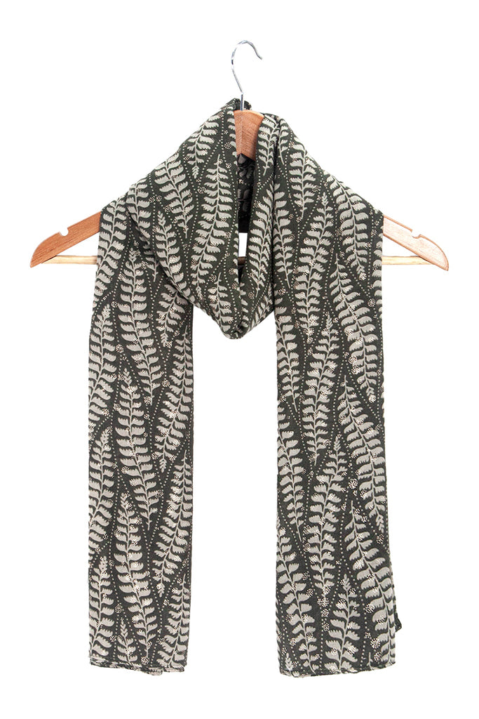 clover-khaki-fern-leaf-lightweight-scarf-draped-on-coat-hanger