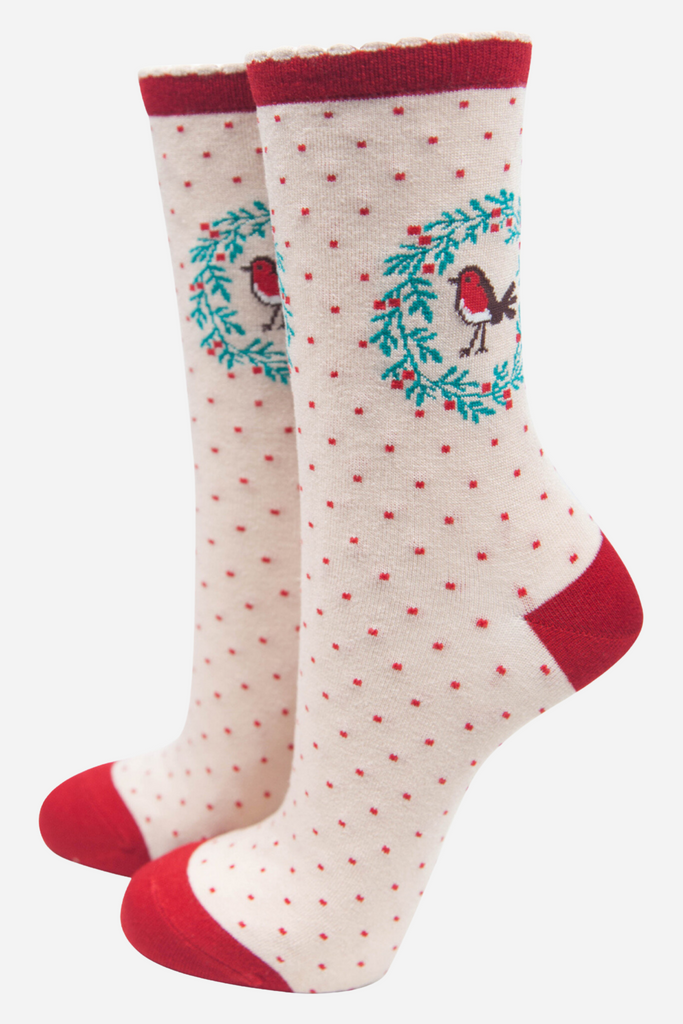 cream socks with red heel, toe and cuff, featuring a red robin bird encircled by a holly garland