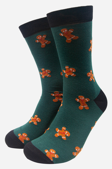 green dress socks with a pattern of gingerbread men all over them