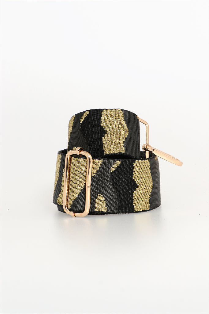 rolled up, showing the gold camo print pattern