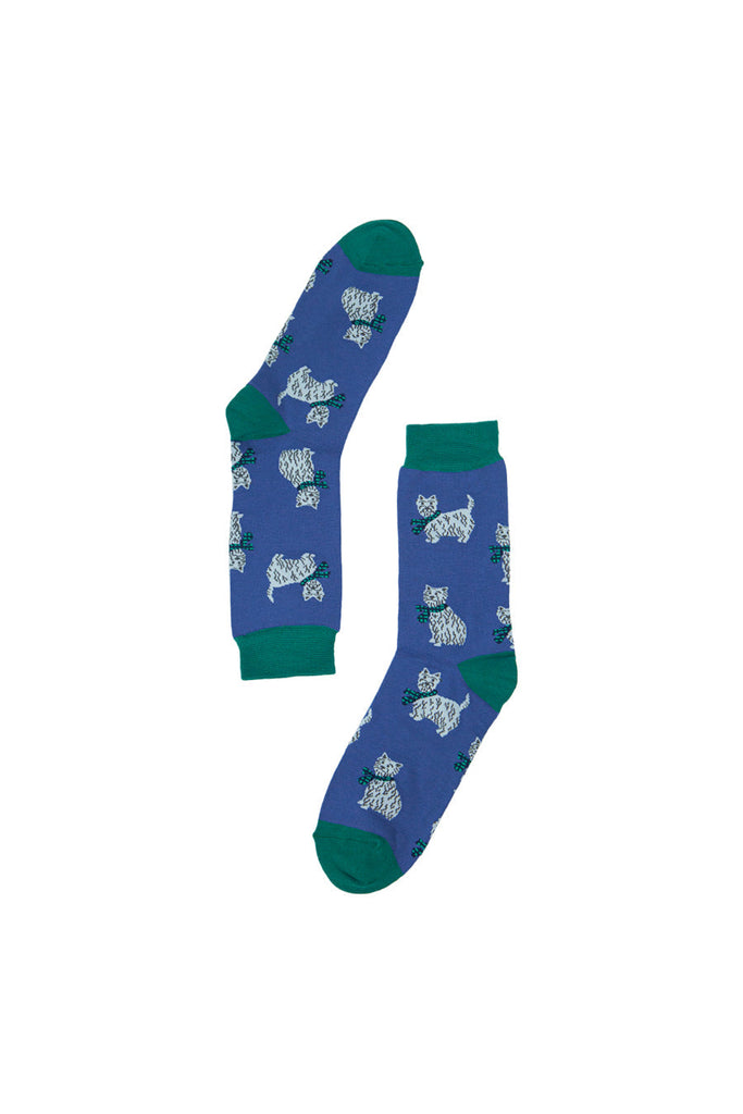 cloes up of the white scottie dog pattern on the blue and green ankle socks