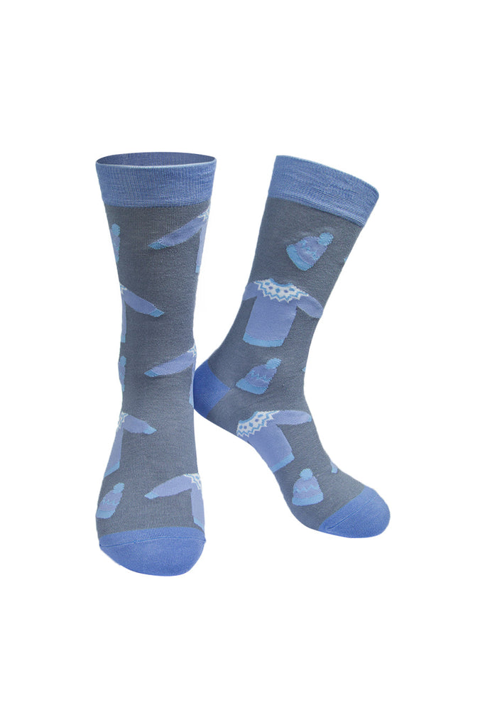 grey socks with light blue heel, toe and cuff with a pattern of christmas jumpers and knitted hats