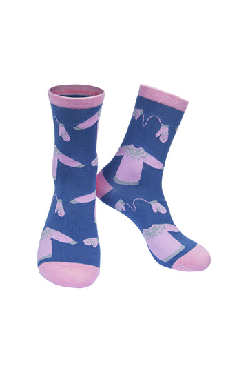 blue socks with a pale pastel pink winter  jumpers, and knitted glove pattern