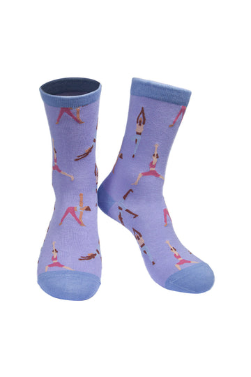 lilac socks with a contrasting blue heel, toe and cuff with an all over pattern of people doing yoga poses