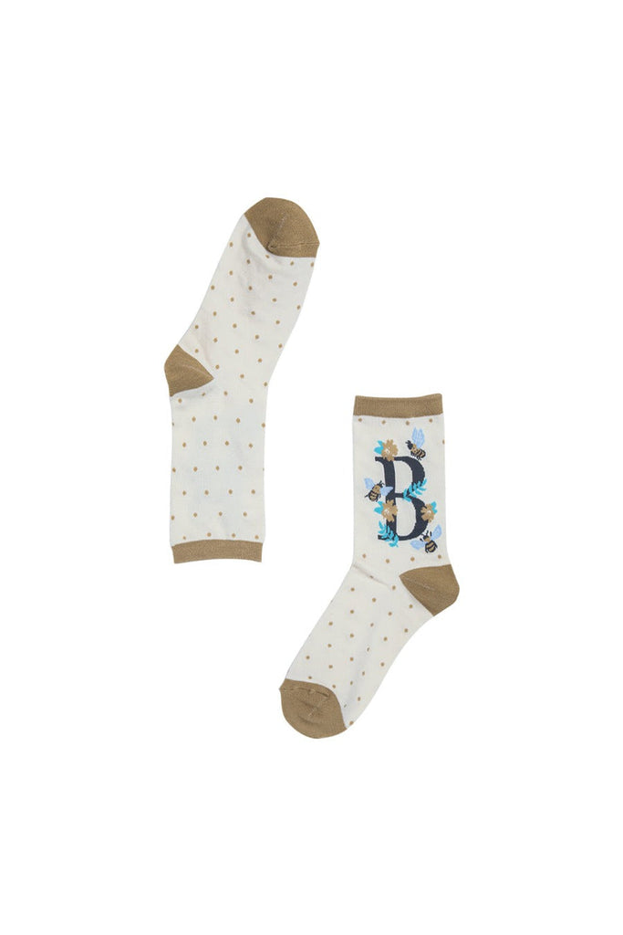 showing that the letter b is visible only on the outer edge of the socks