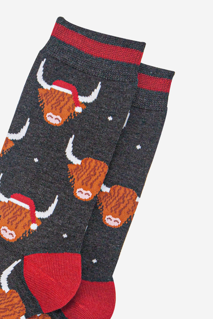 mens-bamboo-socks-black-marl-red-santa-highland-cow-close-up