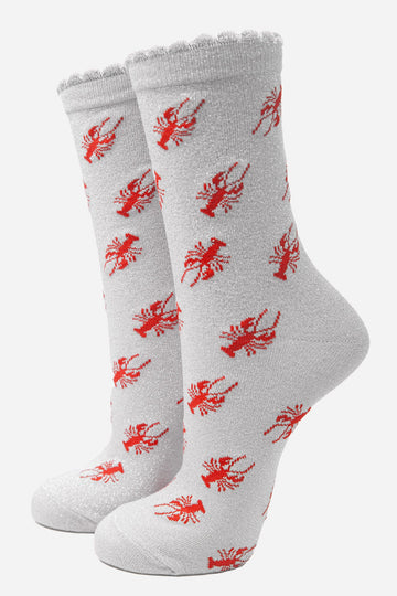 white sparkly glitter socks with scalloped cuffs and an red lobster pattern