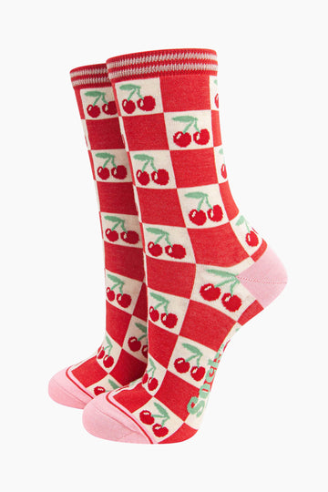 womens-bamboo-socks-cream-red-cherry-squares-socks-standing-upright-the-checked-pattern-is red-and-cream-the-cream-squares-feature-red-cherries