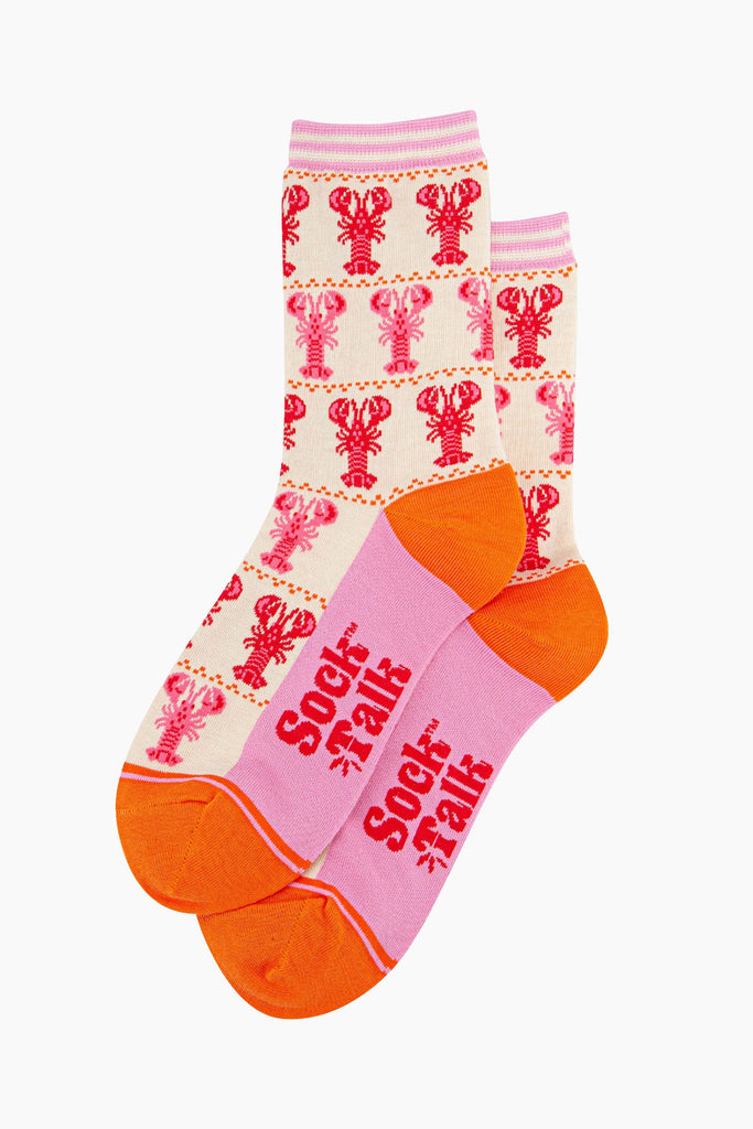 womens-bamboo-socks-cream-lobster-stripes-laying-flat-the-red-and-pink-lobster-pattern-covers-the-entire-design