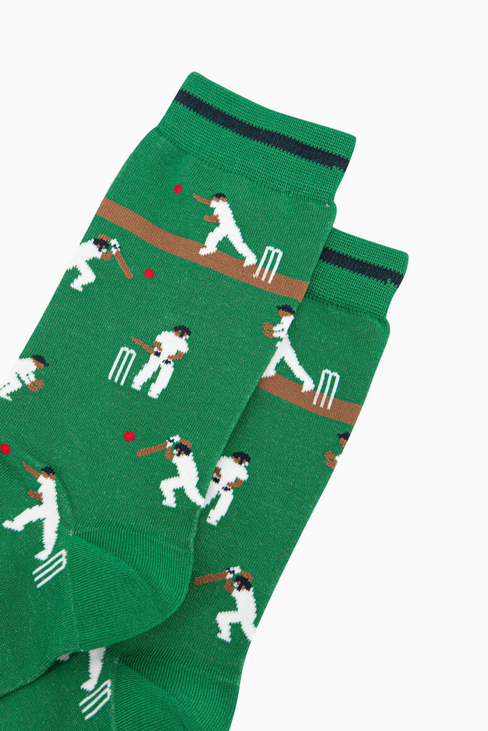 mens-bamboo-socks-green-cricket-players-close-up-cricketers-hitting-red-ball-white-wickets-running