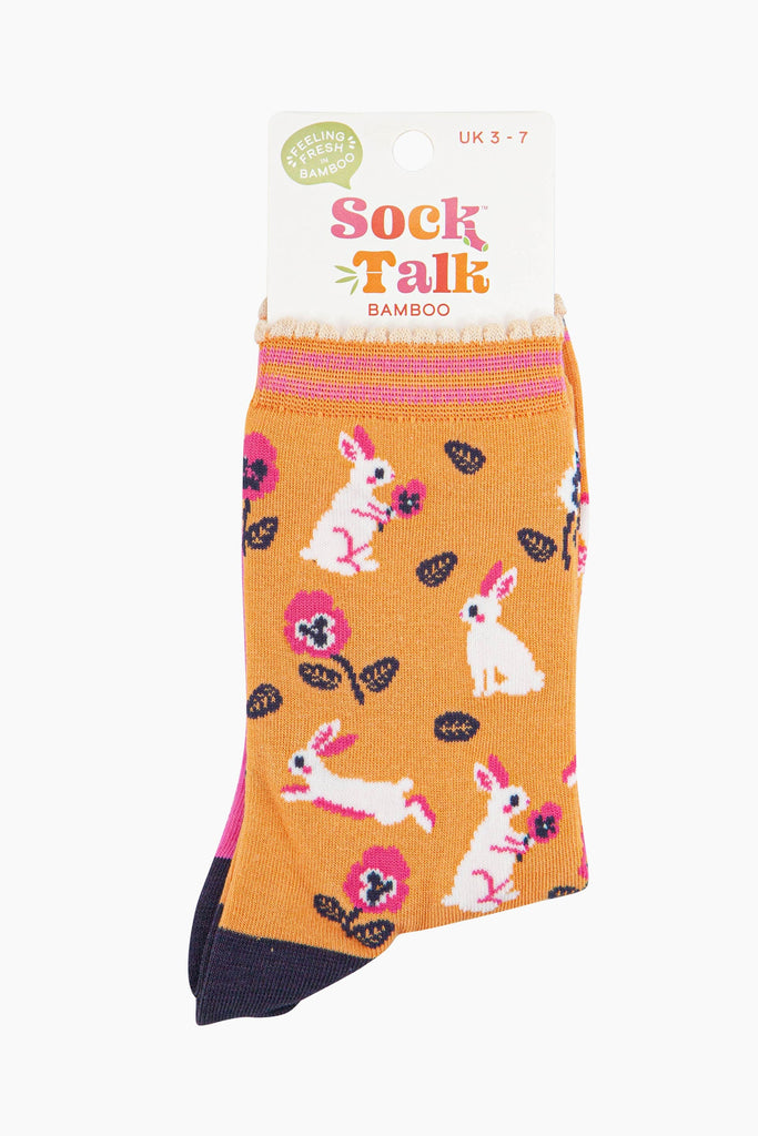 women's orange bamboo rabbit and flower socks in their sock talk packaging, the socks are a uk size 3-7.
