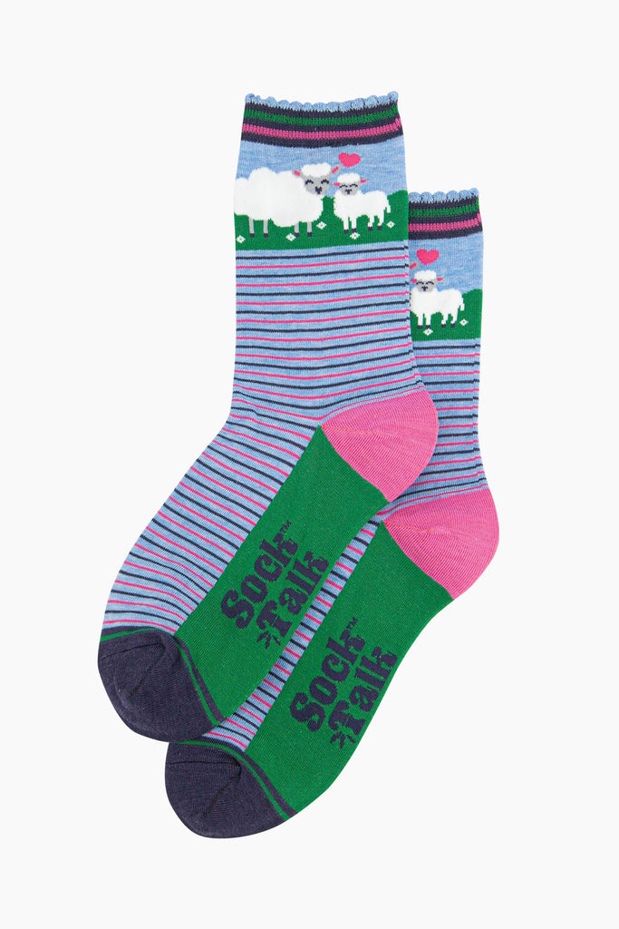 the pair of striped sheep and lamb socks laying flat, one on top of the other. showing clearly the alternating pink and blue pinstripe pattern on the body of the socks. the sheep and lamb feature on the ankle part of the design.