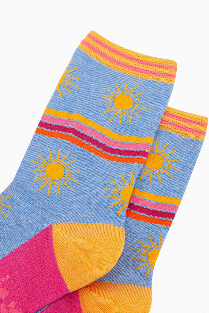 womens-bamboo-socks-blue-sunshine-wavy-stripes-close-up-large-yellow-suns-rainbow-wavy-stripes-in-yellow-pink-fuchsia-orange