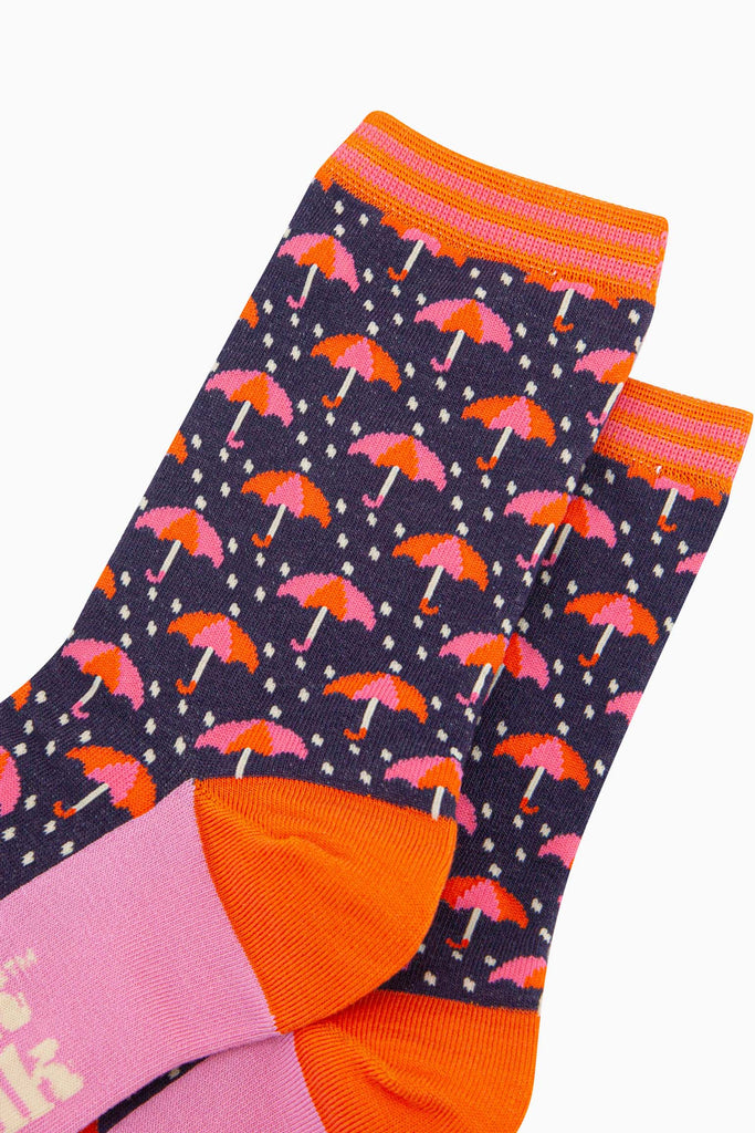 womens-bamboo-socks-navy-umbrellas-and-raindrops-close-up-pink-orange-umbrellas-heavy-rain