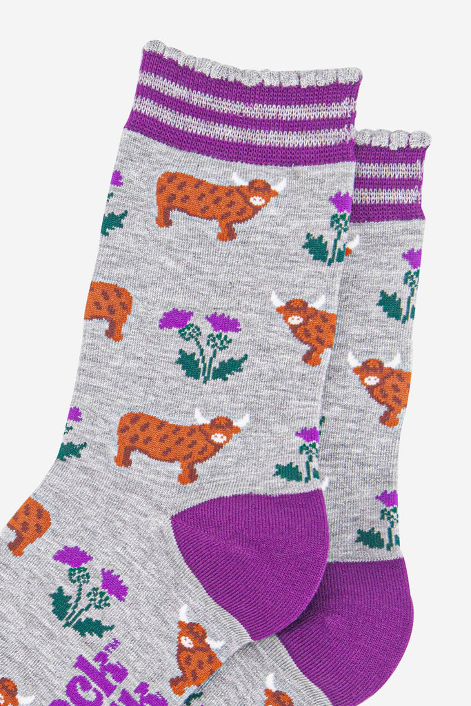 womens-bamboo-socks-light-grey-purple-highland-cow-thistles-close-up
